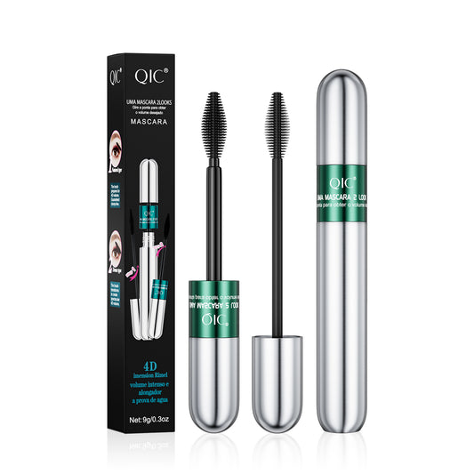 QIC black tubing mascara with silver and green tube, retail packaging and dual-effect applicator